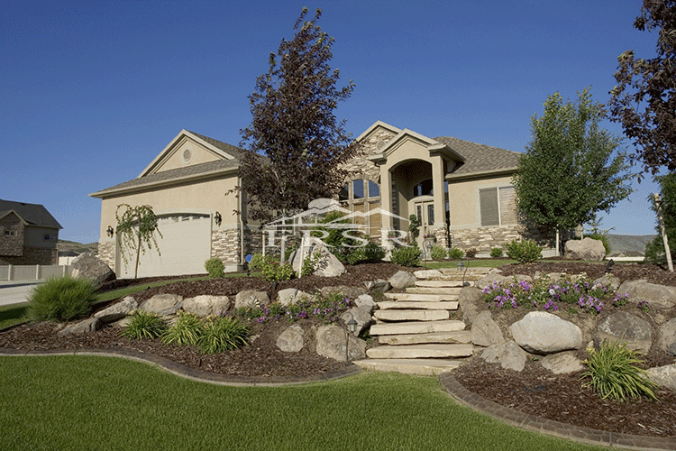 ColoradoScape foundation planting with rock mulch and edging