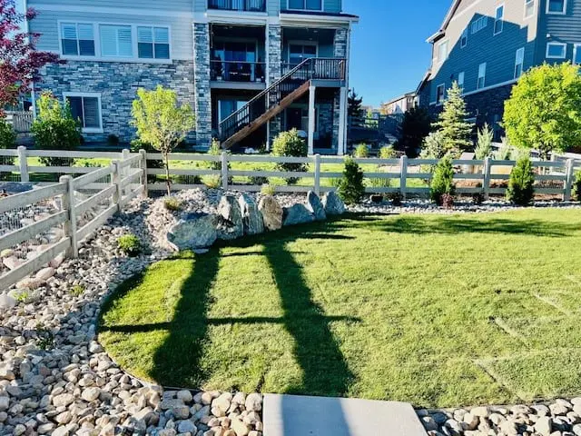 Broomfield backyard stamped concrete and landscaping by FRSR