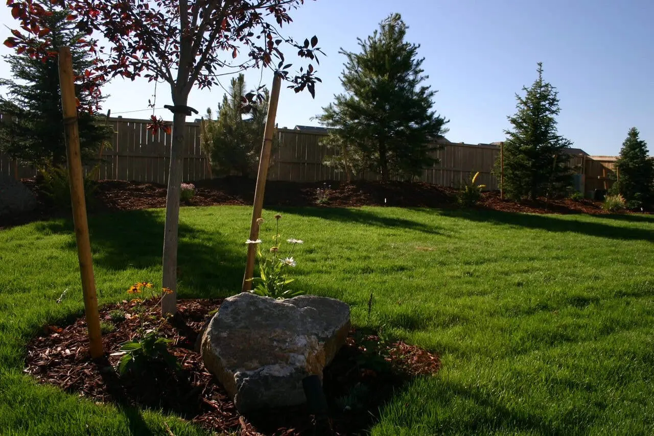 Stamped concrete patio and fire feature by FRSR in Colorado