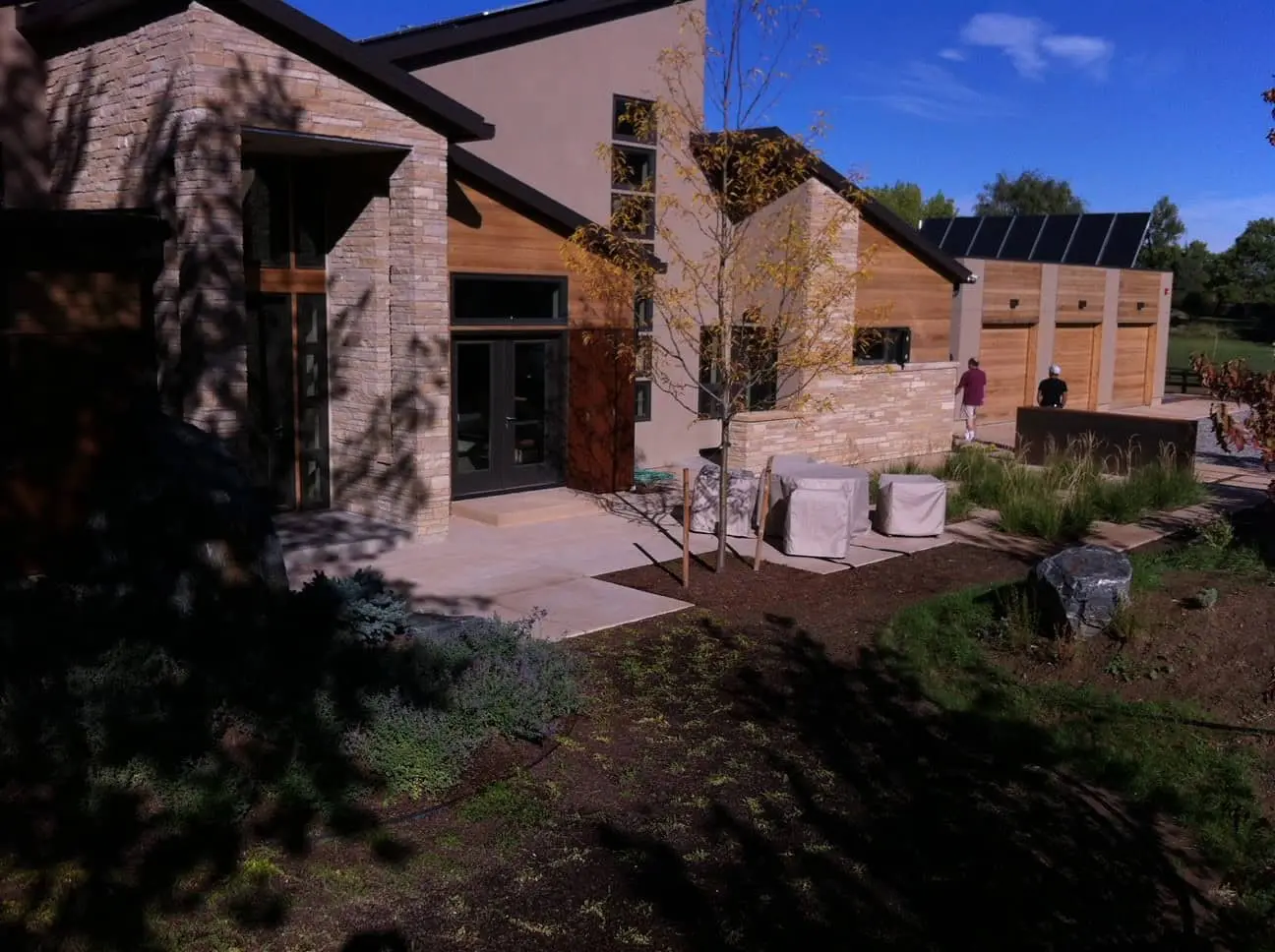 Modern low-water Colorado landscape with artificial turf and outdoor living features