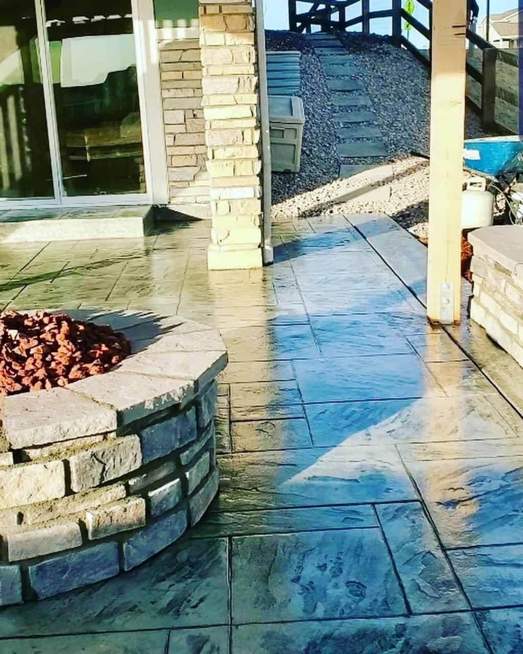 Watt project in Firestone Colorado with stamped concrete patio seatwall and firepit