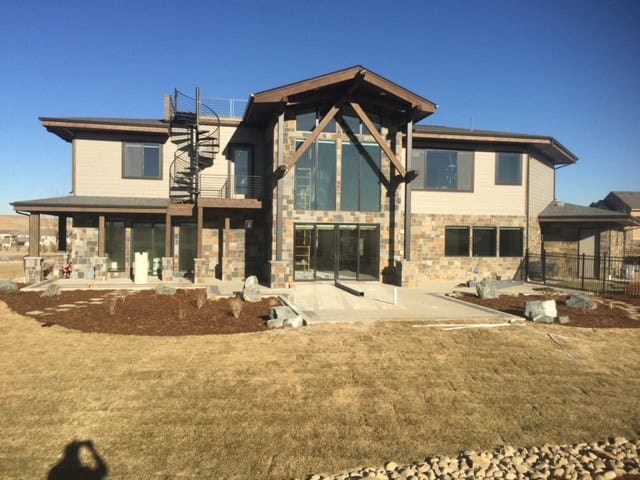 Parker Colorado outdoor living project with stamped concrete and turf by FRSR