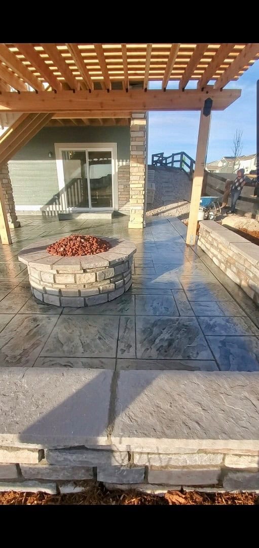 Backyard hardscape with retaining wall, steps and patio in Colorado