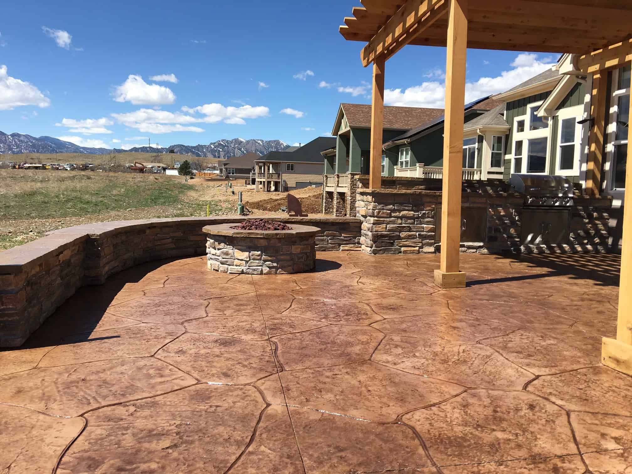 Water-wise Coloradoscape landscape design with rock boulders and drought tolerant planting