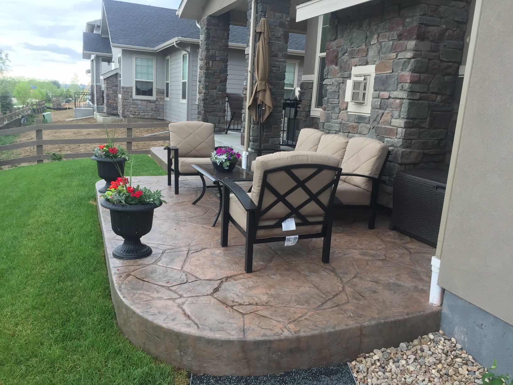 Backyard with stamped concrete patio, turf, and planting near Firestone, Colorado