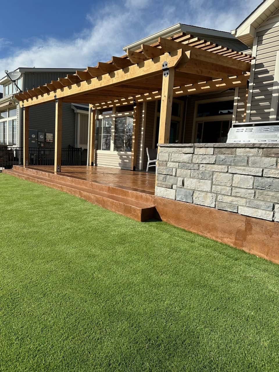 Stamped concrete patio area ready for pergola and outdoor living in Boulder County