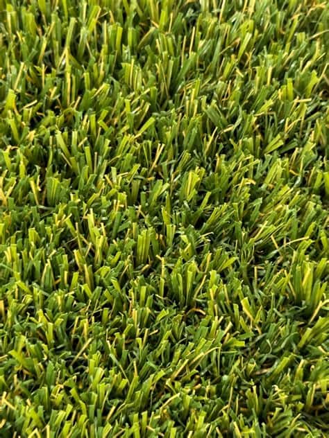 Artificial turf and concrete layout in a Colorado backyard by FRSR