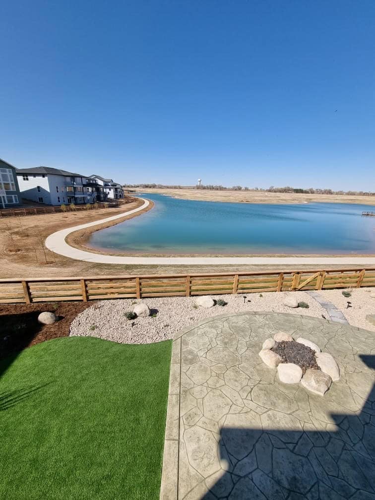 Castle Rock backyard landscaping with patio, turf and planting by FRSR