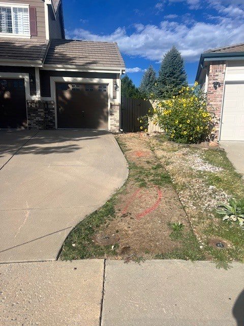 Modern Colorado backyard landscaping with turf and clean design