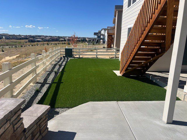 Artificial turf and rock landscape in Parker CO installed by FRSR