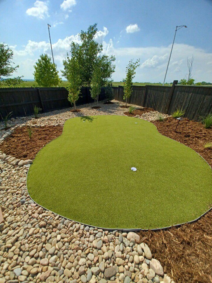 Artificial turf lawn with clean border detail installed by FRSR