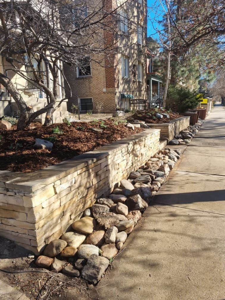 Artificial turf integrated into a modern ColoradoScaping backyard with clean low-maintenance landscaping