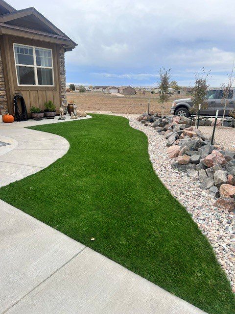Castle Rock backyard project by FRSR with turf and patio