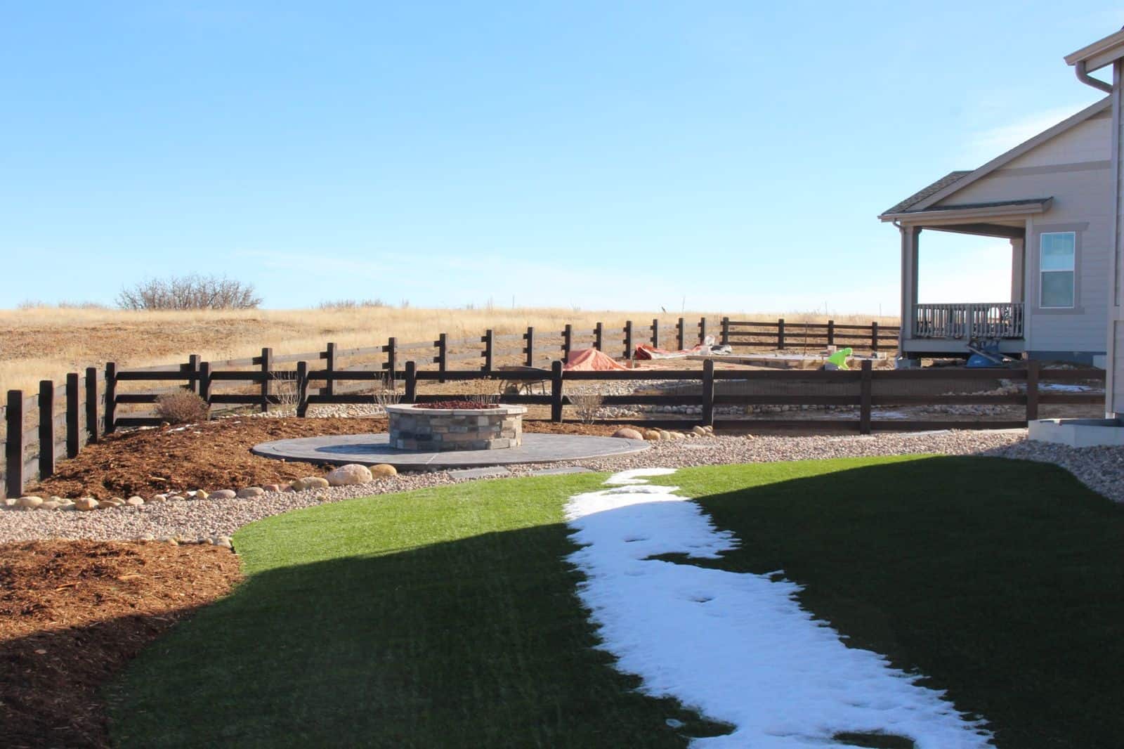 Baessler Project in Castle Rock Colorado turf firepit stamped concrete and full backyard by FRSR