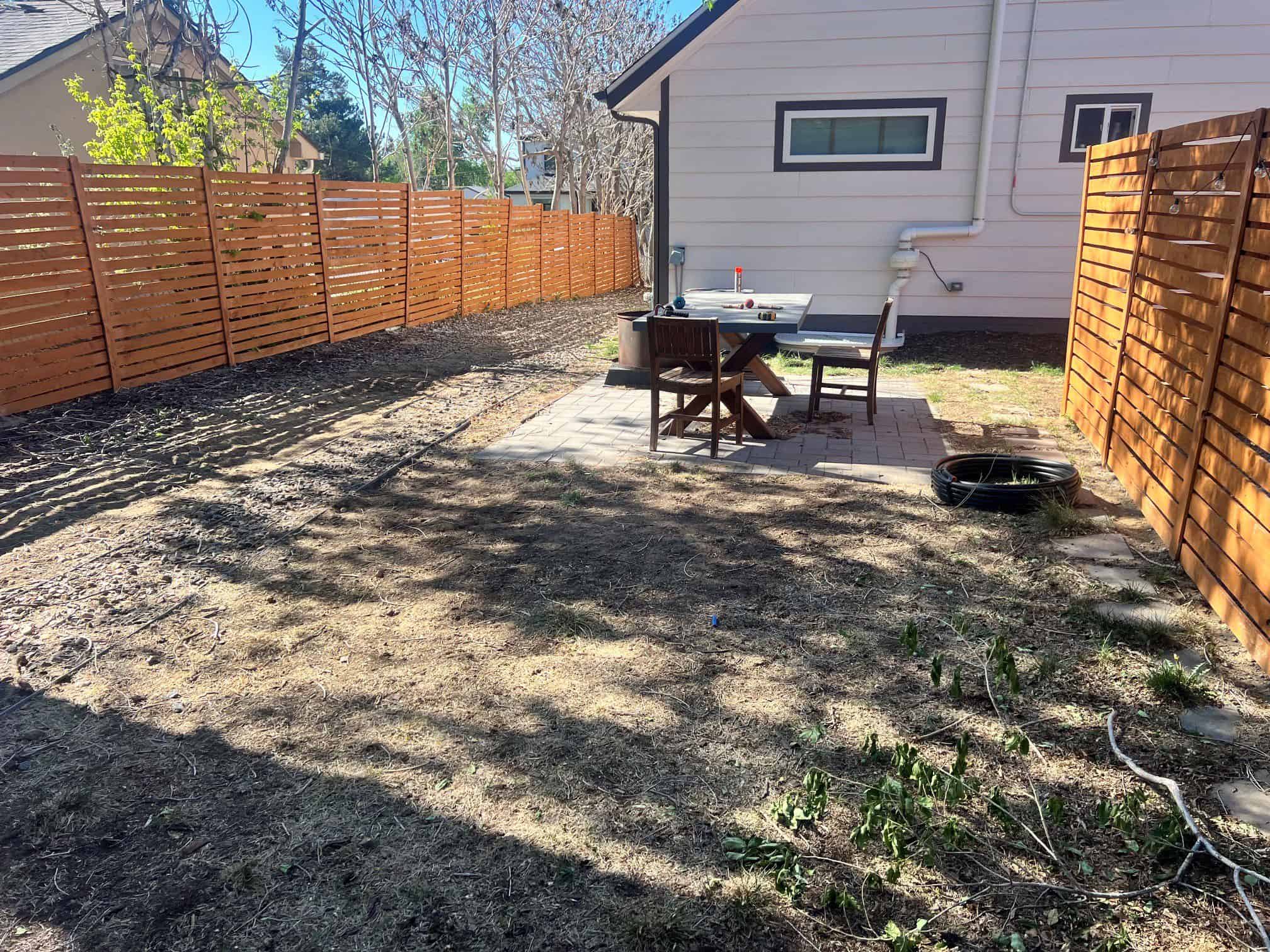 Water-wise ColoradoScaping design with artificial turf, rock, plants, and modern outdoor living in Colorado